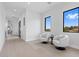 Bright sitting area features plush chairs, large windows offering scenic views, and sleek modern design at 42 Ravenswood Ave, Las Vegas, NV 89141