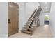 Modern staircase featuring wood treads, black metal railings, and a minimalist design for a contemporary look at 42 Ravenswood Ave, Las Vegas, NV 89141