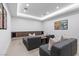 Cozy home theater boasts comfortable seating and wall-mounted movie posters at 42 Ravenswood Ave, Las Vegas, NV 89141