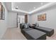 Spacious theater room features gray couches, theater decor, and recessed lighting for an immersive experience at 42 Ravenswood Ave, Las Vegas, NV 89141