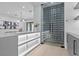 Stylish wine cellar featuring glass doors, custom racking, and elegant design elements in a modern home at 42 Ravenswood Ave, Las Vegas, NV 89141