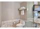 Clean bathroom with modern toilet, glass shower, and towel rack at 4381 W Flamingo Rd # 5220, Las Vegas, NV 89103