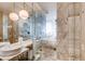 Modern bathroom featuring dual sinks, soaking tub, and luxurious marble finishes at 4381 W Flamingo Rd # 5220, Las Vegas, NV 89103