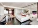 Contemporary suite with a bed, workspace, and partial kitchen view at 4381 W Flamingo Rd # 5220, Las Vegas, NV 89103