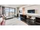 Modern bedroom with city views, entertainment center, and work space at 4381 W Flamingo Rd # 5220, Las Vegas, NV 89103