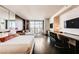 Modern suite featuring a luxurious bed, city views, and a stylish workspace at 4381 W Flamingo Rd # 5220, Las Vegas, NV 89103
