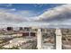 Wide city view featuring the iconic Las Vegas skyline, hotels, and cityscape under a partly cloudy sky at 4381 W Flamingo Rd # 5220, Las Vegas, NV 89103