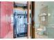 Neat closet featuring a wardrobe with safe, and marble bathroom with glass shower at 4381 W Flamingo Rd # 5220, Las Vegas, NV 89103