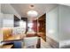 Efficient kitchen with a built-in breakfast bar, modern stainless steel appliances, and a unique light fixture at 4381 W Flamingo Rd # 5220, Las Vegas, NV 89103