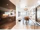 Contemporary kitchen features a breakfast bar and stainless steel appliances, leading to a bright living space with city views at 4381 W Flamingo Rd # 5220, Las Vegas, NV 89103