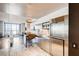 Modern kitchen featuring stainless steel appliances, a breakfast bar, and city views from the living area at 4381 W Flamingo Rd # 5220, Las Vegas, NV 89103