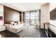 Inviting living room boasts city views, a modern sofa with pillows, and a mounted TV for ultimate comfort at 4381 W Flamingo Rd # 5220, Las Vegas, NV 89103