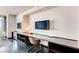Workspace features a sleek desk, entertainment center, and city view at 4381 W Flamingo Rd # 5220, Las Vegas, NV 89103