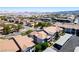 Aerial view of a residential neighborhood with well-maintained condos, parking areas, and desert landscaping at 45 Maleena Mesa St # 223, Henderson, NV 89074
