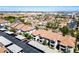 An aerial view showcases a well-planned community with multiple condos, carports, and lush landscaping at 45 Maleena Mesa St # 223, Henderson, NV 89074