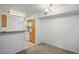 Open kitchen and dining area featuring wood cabinets and white appliances at 45 Maleena Mesa St # 223, Henderson, NV 89074
