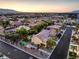 Birds eye view of a backyard featuring a tennis court, storage shed, and a sparkling pool in a private backyard at 4737 Barcelona Ridge Ct, Las Vegas, NV 89129