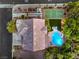 Birds-eye view of a house with a tennis court, a kidney-shaped pool, desert landscaping, and a large backyard at 4737 Barcelona Ridge Ct, Las Vegas, NV 89129