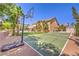Spacious backyard featuring a basketball court, a pickleball court, a pool, and lush landscaping at 4737 Barcelona Ridge Ct, Las Vegas, NV 89129