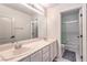 Well-lit bathroom featuring a double sink vanity and a separate shower/tub at 4737 Barcelona Ridge Ct, Las Vegas, NV 89129