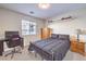 Bedroom with a bed, desk, and natural light at 4737 Barcelona Ridge Ct, Las Vegas, NV 89129