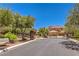 Gated entrance to the neighborhood, featuring meticulously maintained landscaping and an attractive, secure entry at 4737 Barcelona Ridge Ct, Las Vegas, NV 89129