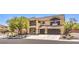 Lovely two-story home with a balcony, a three-car garage, desert landscaping, and neutral paint colors at 4737 Barcelona Ridge Ct, Las Vegas, NV 89129