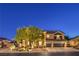 Charming two-story home featuring a three-car garage and well-manicured landscaping at 4737 Barcelona Ridge Ct, Las Vegas, NV 89129