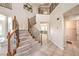 Grand foyer showcasing a staircase with ornate wrought iron railings and a view of the living spaces at 4737 Barcelona Ridge Ct, Las Vegas, NV 89129