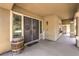 Charming covered front porch with double doors, decorative wreaths, and a rustic wine barrel at 4737 Barcelona Ridge Ct, Las Vegas, NV 89129