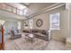 Bright and airy living room showcasing neutral furniture, large windows, and a soaring ceiling at 4737 Barcelona Ridge Ct, Las Vegas, NV 89129