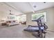 Large primary bedroom including exercise equipment, with ample natural light and a ceiling fan at 4737 Barcelona Ridge Ct, Las Vegas, NV 89129