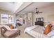 Spacious primary bedroom retreat featuring sitting area, ceiling fan, and an exercise space at 4737 Barcelona Ridge Ct, Las Vegas, NV 89129