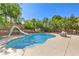 Sparkling pool with a slide and well maintained landscaping in backyard at 4737 Barcelona Ridge Ct, Las Vegas, NV 89129