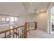 Upstairs hallway with wrought iron railing overlooking the entry at 4737 Barcelona Ridge Ct, Las Vegas, NV 89129