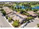 Stunning aerial view of the community featuring a lake, golf course, and solar panels on the roofs at 5170 Agio Ave, Pahrump, NV 89061
