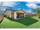 Back yard with patio and lush artificial grass at 5170 Agio Ave, Pahrump, NV 89061