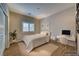 Comfortable bedroom with a desk, neutral decor, and natural light at 5170 Agio Ave, Pahrump, NV 89061