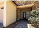 Welcoming home entrance featuring stone accents, a brick walkway, and mature landscaping at 5170 Agio Ave, Pahrump, NV 89061