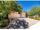 Charming single-story home featuring stone accents, a three-car garage, and a brick paver driveway at 5170 Agio Ave, Pahrump, NV 89061