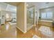 Bright main bathroom with a glass shower and soaking tub at 5170 Agio Ave, Pahrump, NV 89061