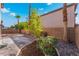 Beautiful backyard showcasing desert landscaping, trees, and a brick-paved area for outdoor enjoyment and relaxation at 5340 Santa Fe Heights St, North Las Vegas, NV 89081