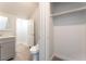 Bright bathroom with gray vanity, toilet, and closet with ample storage space and tiled floors at 5340 Santa Fe Heights St, North Las Vegas, NV 89081