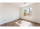 Bedroom with wood-style flooring and natural light from a window at 5340 Santa Fe Heights St, North Las Vegas, NV 89081