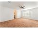 Large bedroom with natural light, neutral carpet, and an ensuite bathroom entrance providing a peaceful retreat at 5340 Santa Fe Heights St, North Las Vegas, NV 89081
