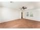 Spacious bedroom with neutral carpet, ceiling fan, and natural light, creating a relaxing and inviting atmosphere at 5340 Santa Fe Heights St, North Las Vegas, NV 89081