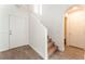 Inviting foyer with tile flooring, stairs to the upper level, and access to other rooms of the home at 5340 Santa Fe Heights St, North Las Vegas, NV 89081
