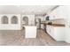 Modern kitchen with stainless steel appliances, white cabinets, granite countertops, and an open layout at 5340 Santa Fe Heights St, North Las Vegas, NV 89081