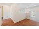 Upstairs loft space featuring neutral carpet, natural light, and doorway with access to other rooms of the house at 5340 Santa Fe Heights St, North Las Vegas, NV 89081