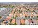 Expansive aerial view of a community featuring uniform homes with terracotta roofs at 5526 Spruce Hill Ct, Las Vegas, NV 89148